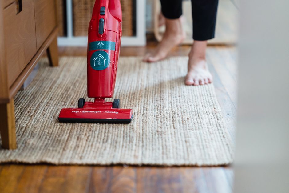 Close up of a professional vacuuming a carpet